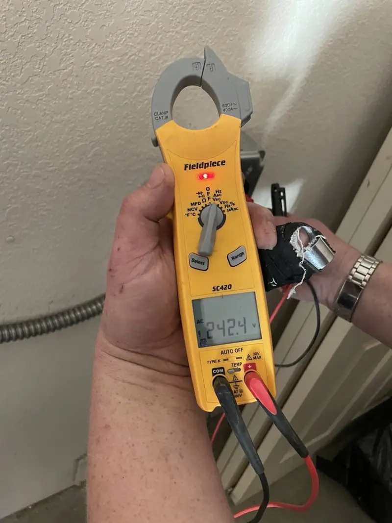 Voltage testing with clamp meter during Circuit Breaker Repair in Rigby